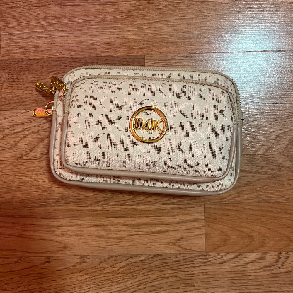 Tab and gold handbag